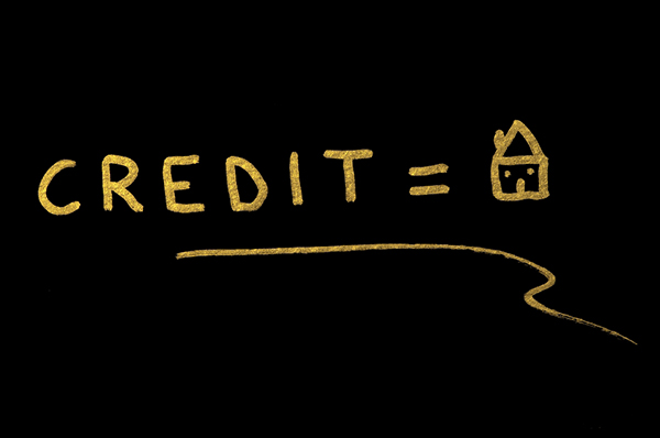 chalk board with credit equals home written on it
